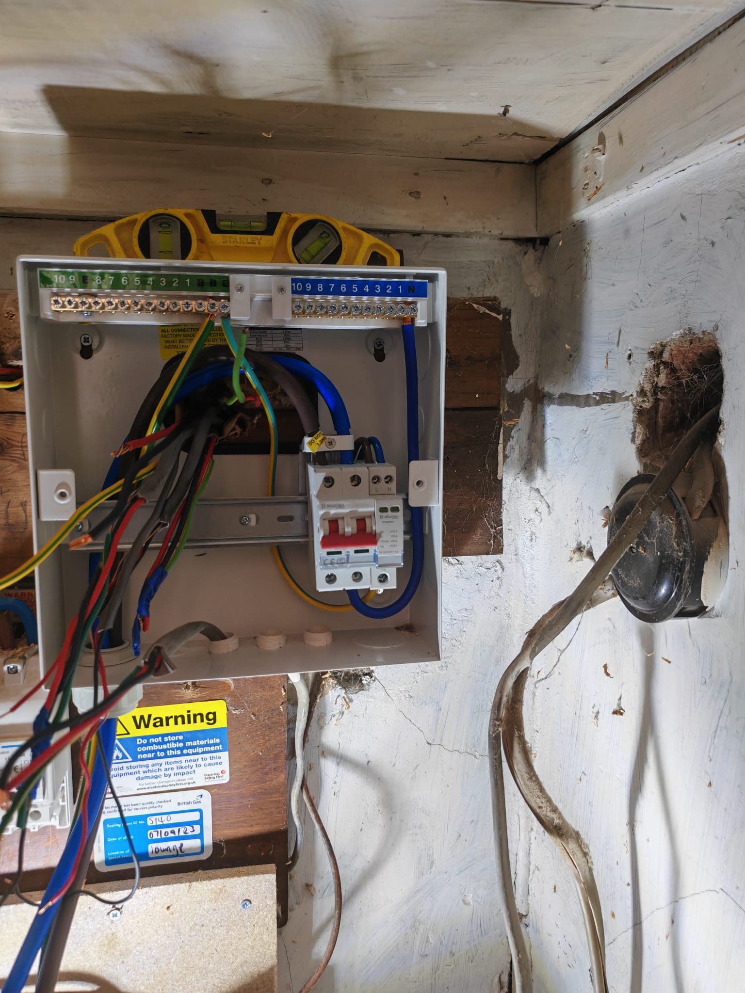 New consumer unit mounted on the wall ready for wiring