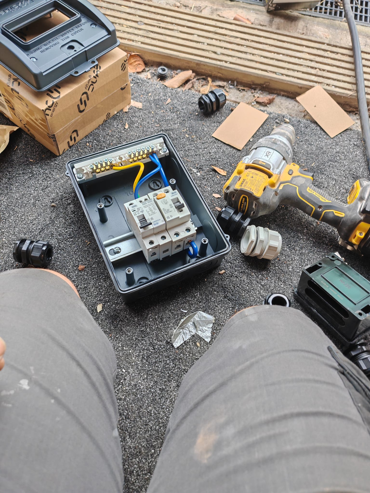 Weatherproof outdoor electrical enclosure being wired on site