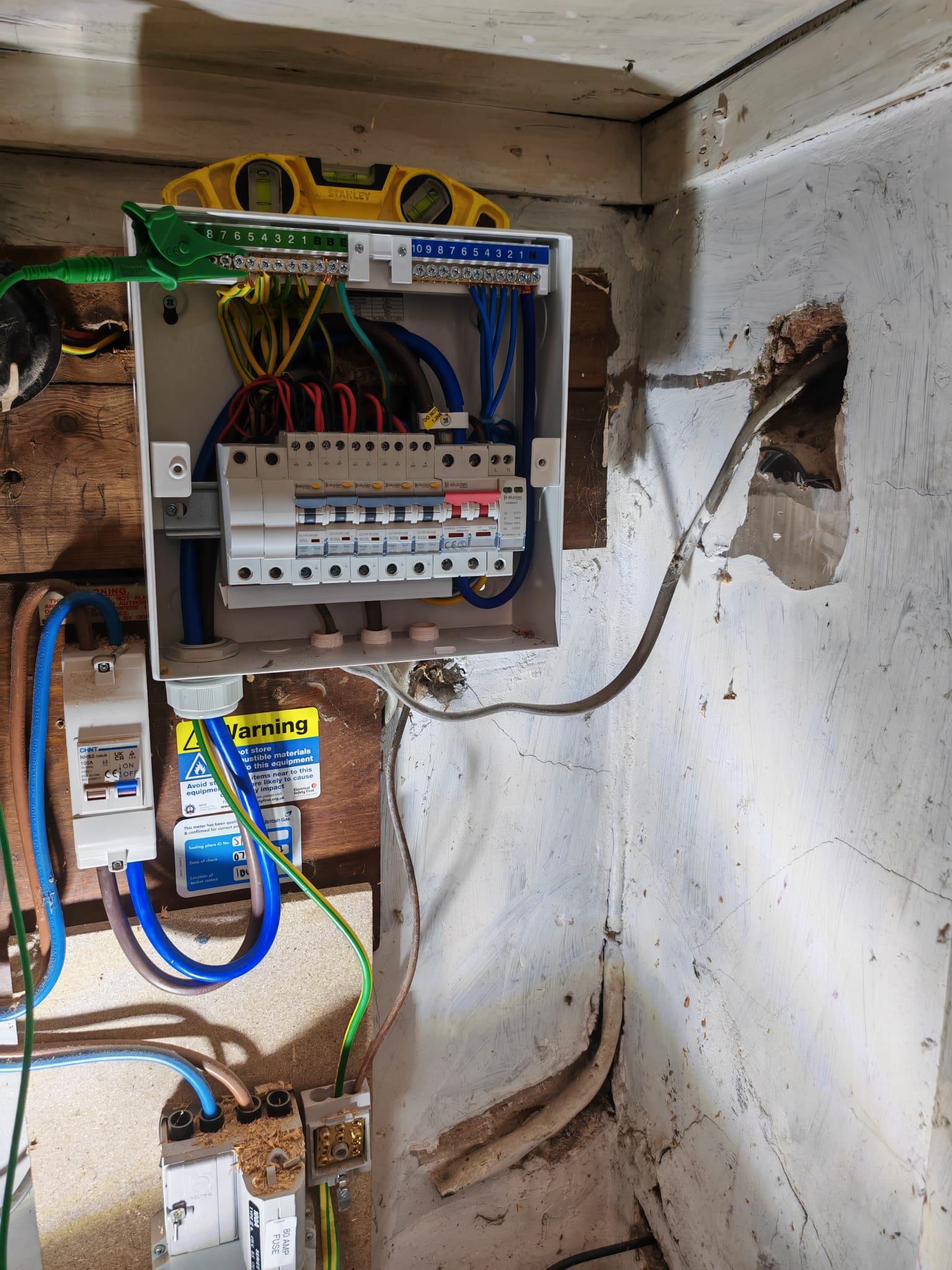 New consumer unit wired in place next to the electricity meter
