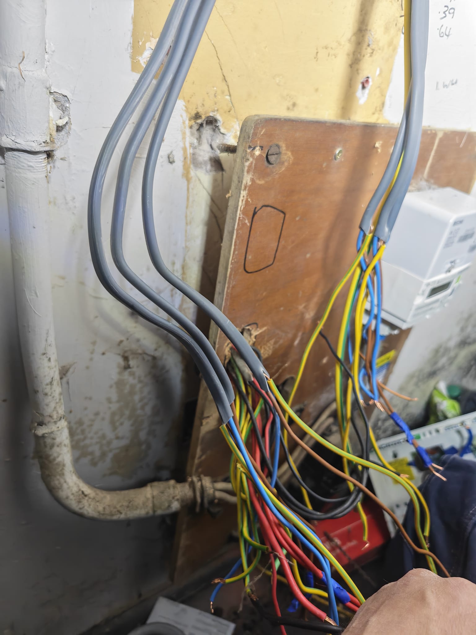 Cables run into a new consumer unit fixed to the wall