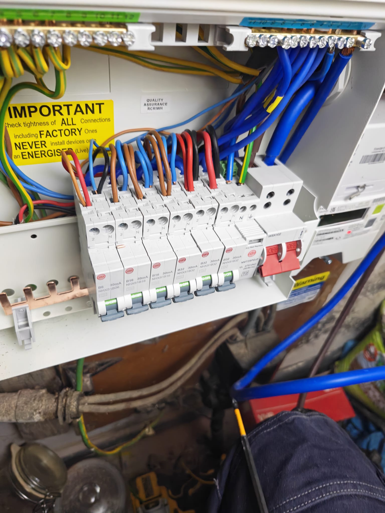 RCBOs wired into a new consumer unit with brown, blue, black and red cables