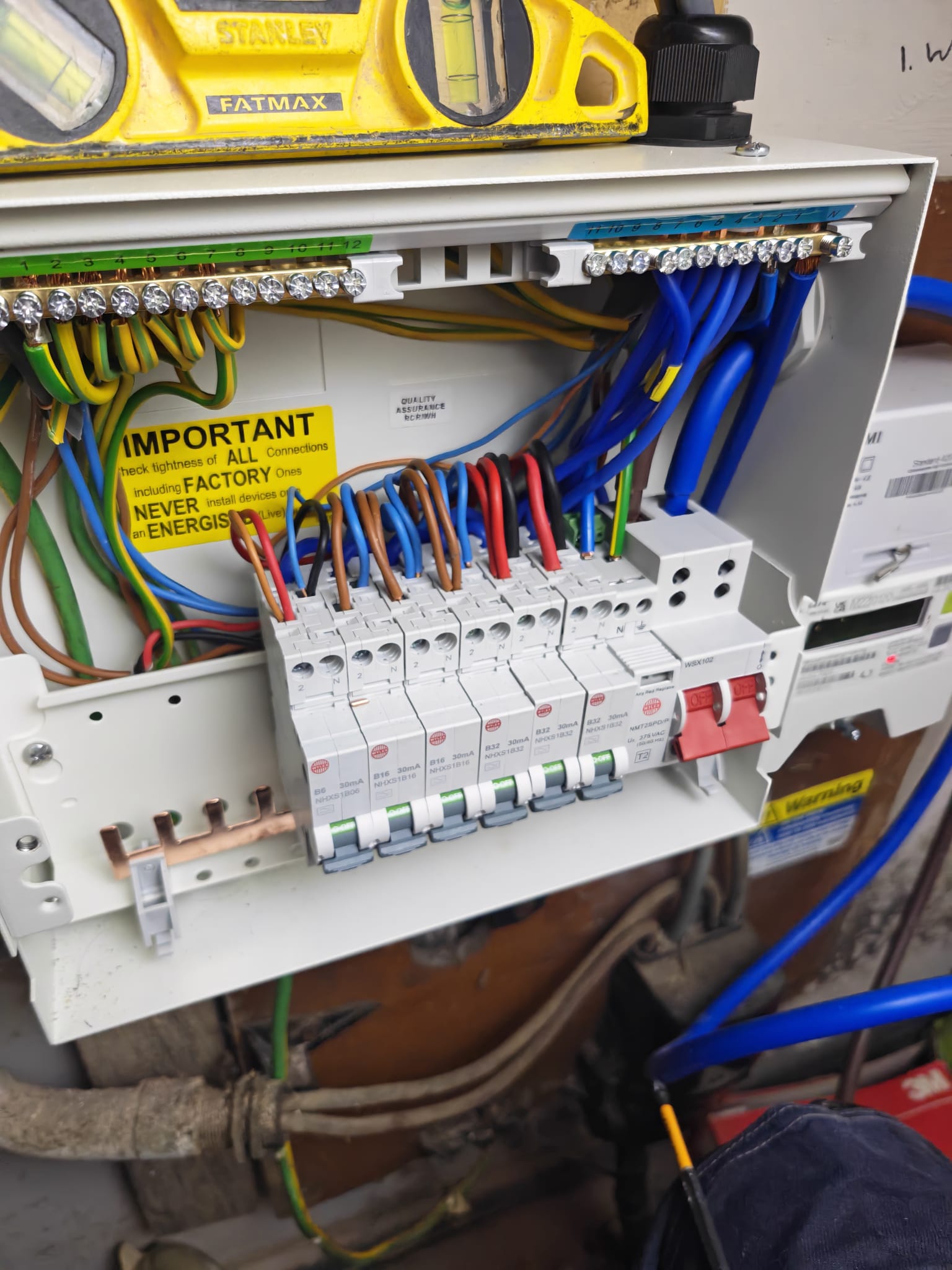 Close-up of consumer unit RCBOs being connected