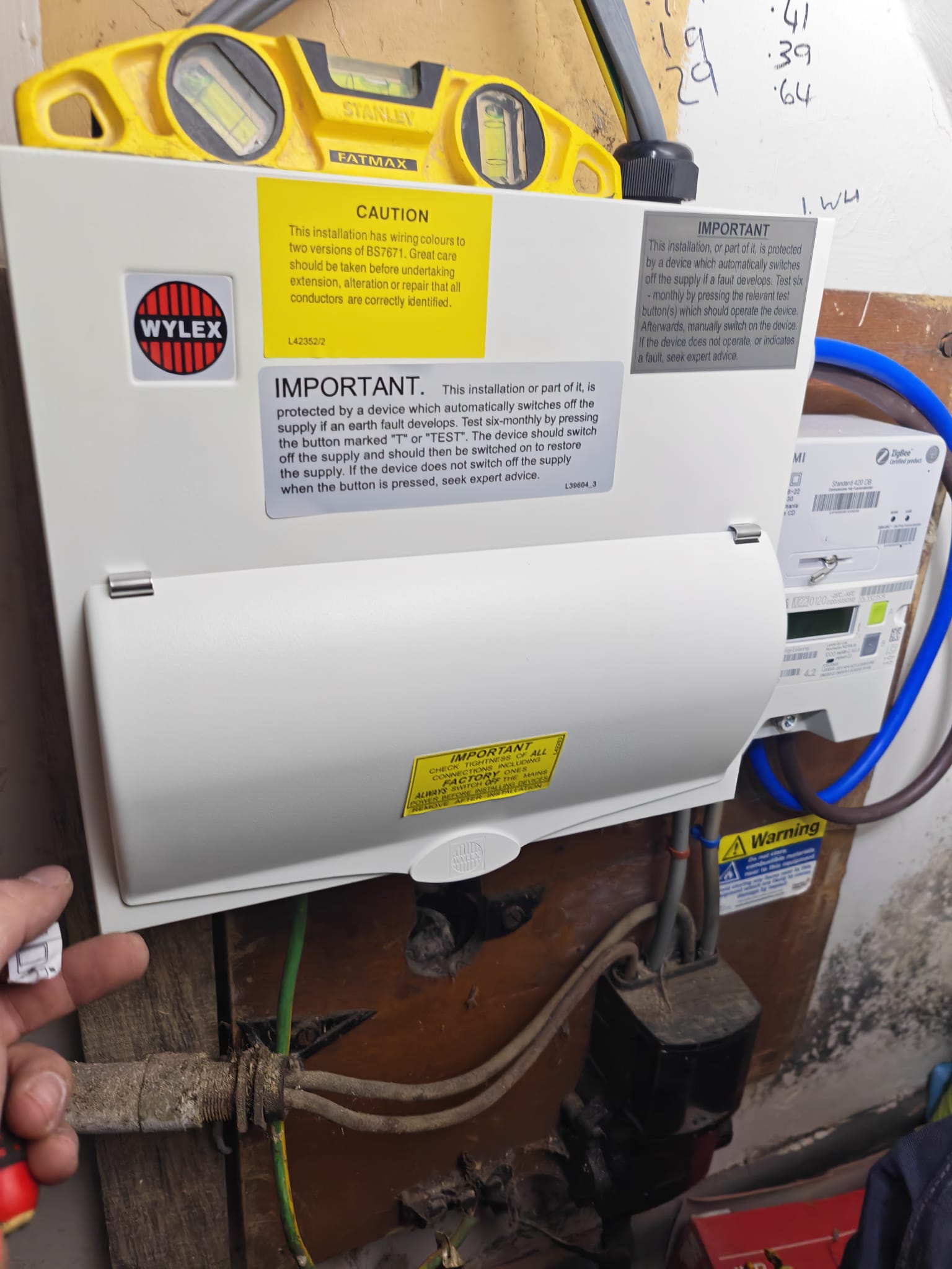 New Wylex consumer unit with cover closed and safety labelling in place